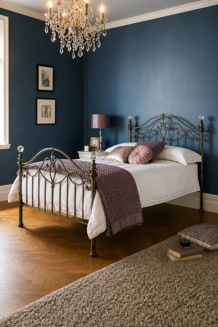 Antique Brass Scrollwork Glows Against Inky Blue Walls