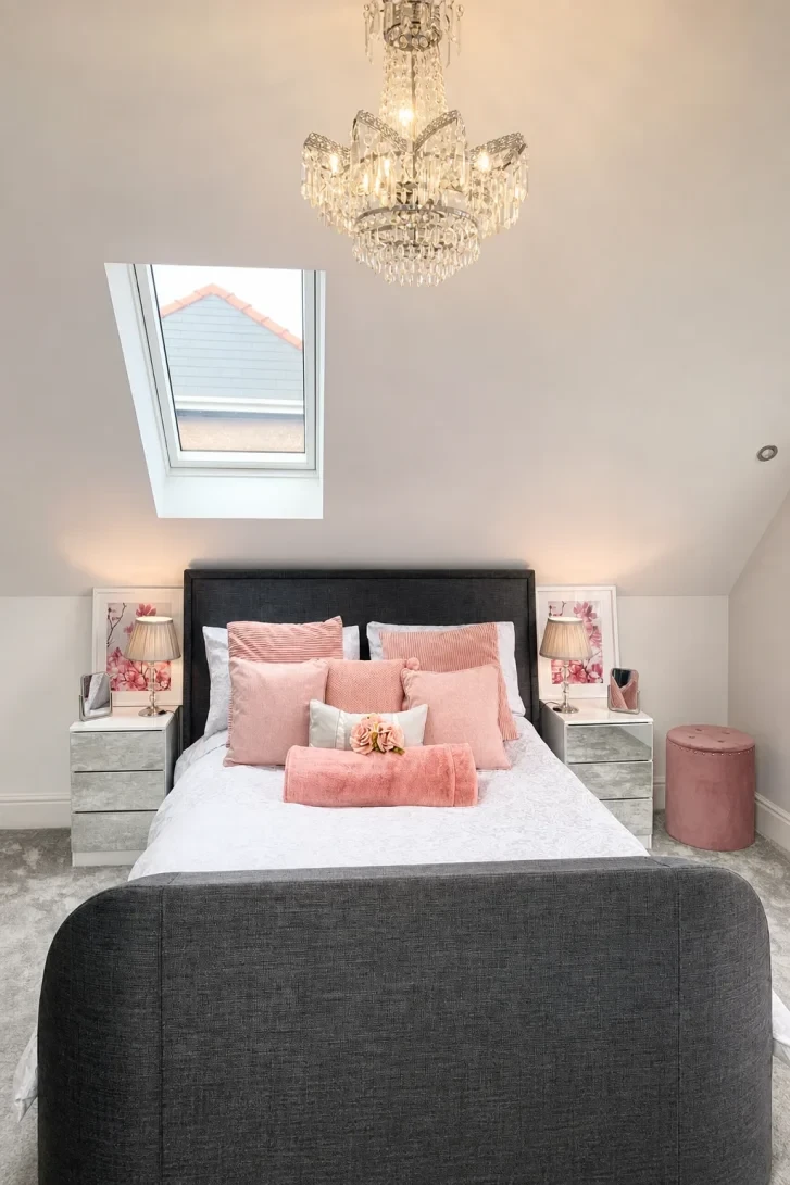 Crystal Chandelier Crowns a Sloped Attic Ceiling