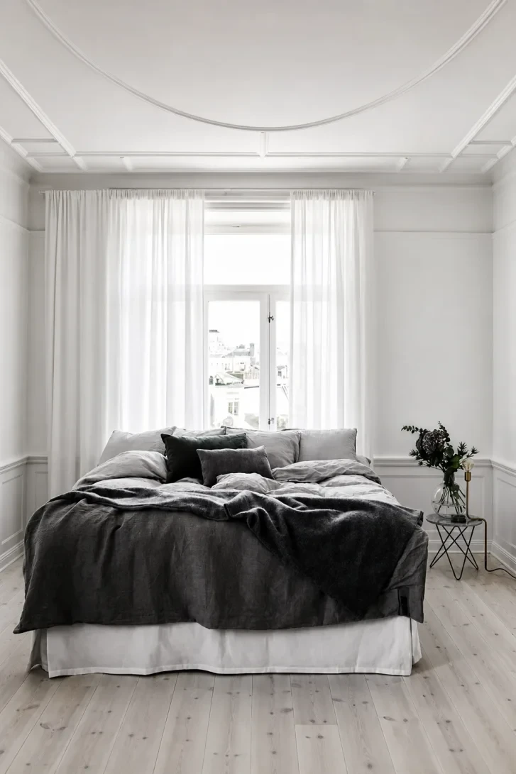 Dark Velvet Throw Against a White Plaster Ceiling