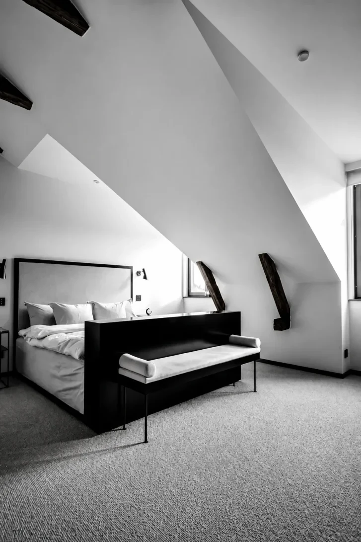Exposed Timber Beams Meet Razor-Sharp Monochrome Geometry