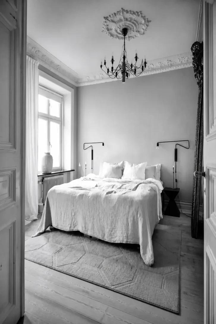 Ornate Plaster Ceiling Meets Black Iron Chandelier